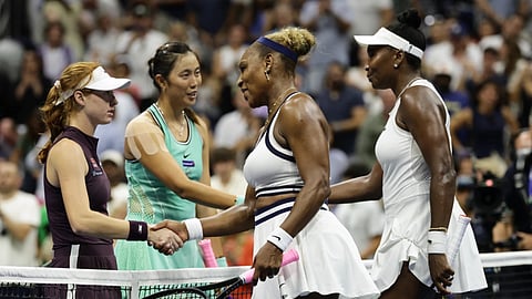 Venus, right, and Serena Williams, of the United States, congratulate Maya Joint, left, of Australia, and Hao-Ching Chan, of Taiwan, after their women's doubles match at the US Open tennis championships