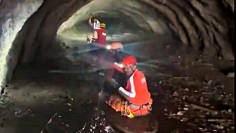 Indian tunnel rescue team personnel and Nepali Army personnel carry out rescue operations at the Chilime tunnel, in Rasuwa, Nepal