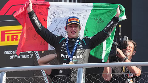 Mercedes driver Andrea Kimi Antonelli of Italy celebrates on the podium after winning the Italian Formula One Grand Prix race, in Monza, Italy