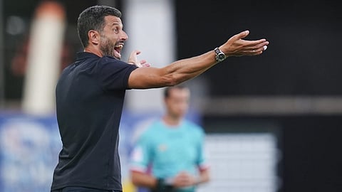 Fiorentina's head coach Fabio Grosso shouts instructions to his players during the Serie A soccer match between Fiorentina and Frosinone, in Florence, Italy