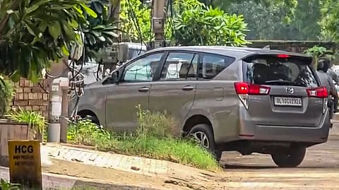 A Delhi Police vehicle arrives at the residence of Hariram Bansal, owner of the collapsed Satya Niketan PG building, following a building collapse in Delhi that left several dead and injured, in Gurugram, Monday, Sept. 7, 2026.