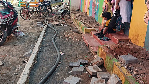 The exposed electrical wires that are posing a threat to children.