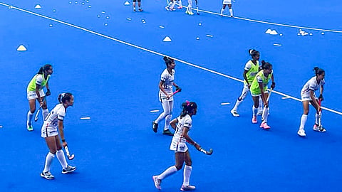 India's women hockey team players warm up ahead of a match against Australia during the FIH Women's Hockey World Cup, in Amstelveen