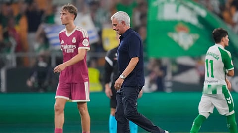Real Madrid's head coach Jose Mourinho leaves the pitch after the Spanish La Liga soccer match between Real Betis and Real Madrid in Seville, Spain