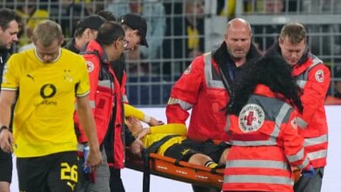 Dortmund's Konstantinos Karetsas is carried off the pitch by medical staff during the Champions League opening phase soccer match between Borussia Dortmund and Villarreal in Dortmund, Germany, Tuesday, Sept. 8, 2026