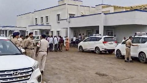 Police personnel conduct an investigation as they arrive at a hospital after six persons died, and as many as five others fell ill following alleged consumption of spurious liquor, in Sagar district, Madhya Pradesh.