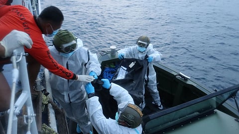 In this handout provided by the Philippine Coast Guard, rescuers transfer the remains of victims of the recent fire on the MV June Aster ferry on Friday Sept. 11, 2026 off Coron, Palawan province, western Philippines.
