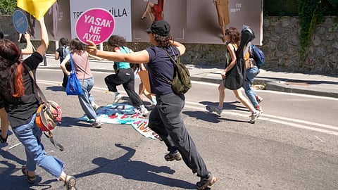 People run from the police during a march in support of transgender people and their rights during the LGBTQ Pride week, in Istanbul, Turkey, on June 21, 2026