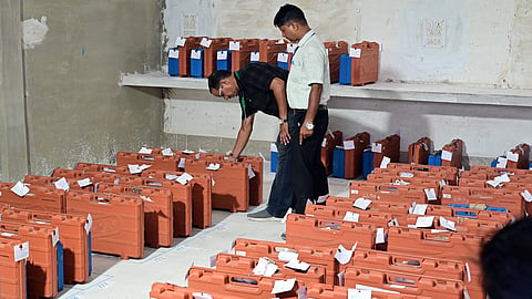 A polling official places the Electronic Voting Machines (EVM) and Voter Verifiable Audit Paper Trails (VVPAT) during the counting of votes for the Rajasthan urban local body elections, at a counting centre, in Jaipur, Monday, Sept. 14, 2026