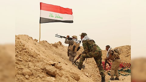 Fighters from the Badr Brigades Shiite militia clash with an Islamic State militant group at the front line on the outskirts of Fallujah in the Anbar province of Iraq.