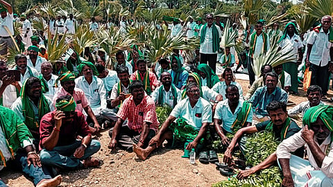 Farmers from 40 associations stage a waiting-protest at Samayapuram in Tiruchy on Tuesday.