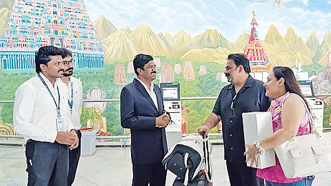 Tiruchy Airport director G Gopalakrishnan interacting with flyers