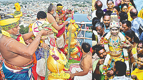 Priests perform Kumbabhishekam at the Meenakshi Sundareswarar temple on Thursday; (right) a child dressed like the Goddess