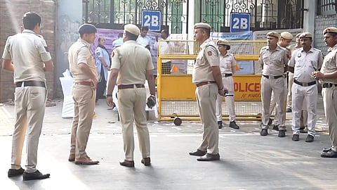 Security personnel and officials during the counting of vote for the Delhi University Students' Union (DUSU) elections as it gets underway amid heightened security, in New Delhi, Saturday, Sept. 19, 2026