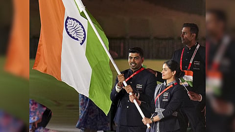 India's double Olympic medalist from Paris 2024 Manu Bhaker and kabaddi player Pawan Sehrawat lead the contingent at the athletes' parade, during the opening ceremony of the 20th Asian Games, in Nagoya, Japan.