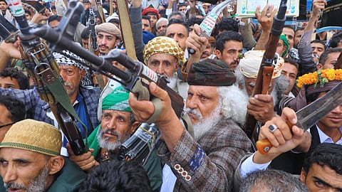 Supporters of Yemen’s Houthi rebels raise their rifles during a rally in support of the group and to protest Saudi Arabia’s accusation that the Houthis targeted Islam’s holiest site of Mecca, in Sanaa, Yemen, Friday, Sept. 18, 2026