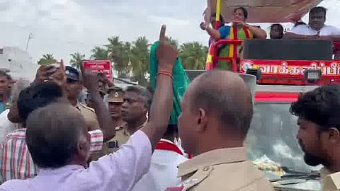 People confront P Sathyabama during her campaign in Dharapuram.
