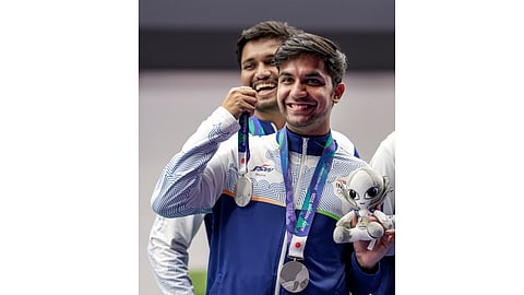 India's Rudrankksh Patil celebrates after winning silver medal in the 10 meter rifle men team event in the ongoing 20th Asian Games 2026, in Nagoya, Japan, Monday, Sept. 21, 2026.