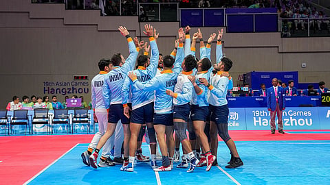 Indian team cheers during the Men's Team Semifinal Kabaddi match against Pakistan at the 19th Asian Games.