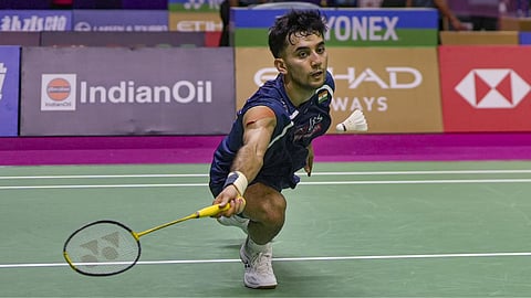 India's Lakshya Sen returns a shot during a men's singles round of 32 badminton match against USA's Garret Tan, unseen, at the BWF World Championships, at IGI Stadium, in New Delhi.