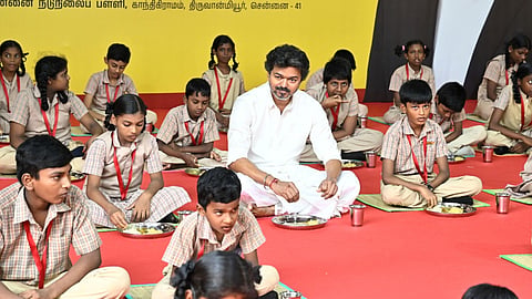 CM Vijay shares meals with school students