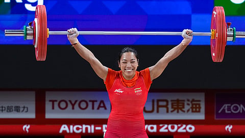 India's Mirabai Chanu holds a silver medal after competing in the Women's 49kg Group A weightlifting final match during the 20th Asian Games, in Nagoya, Japan, Wednesday, Sept. 23, 2026