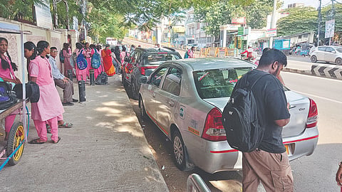 Cars parked outside school along Peters Road in Royapettah
