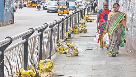 Cleared silt kept in gunny bags on the pavement in Anna Salai