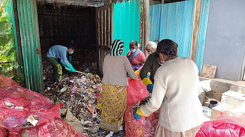 The accumulated garbage being removed by the municipality staff 