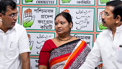 West Bengal Pradesh Congress Committee (WBPCC) President Subhankar Sarkar, right, Arpita Pradhan wife of jailed Congress candidate Milan Pradhan for the Nandigram assembly by-poll, centre, and AICC in-charge for West Bengal Prakash Joshi during a press conference, in Kolkata, Thursday, Sept. 24, 2026