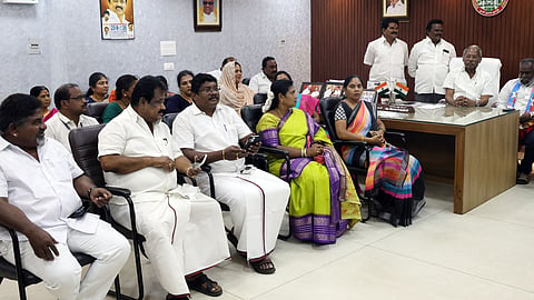 Mayor A Ramachandran, council members protesting inside Corporation premises in Salem on Friday