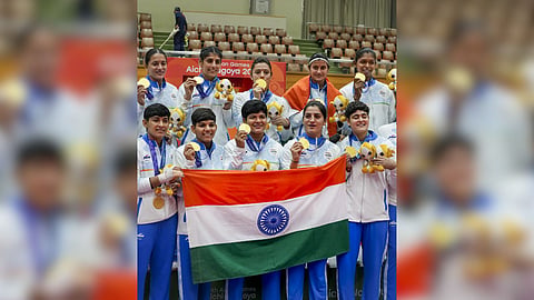 India's players hold national tricolour flag as they pose for photographs after winning Gold medal in the women�s final Kabaddi match against Iran in the ongoing 20th Asian Games, in Tokai City, Japan.