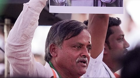 Congress workers hold placards as they stage a protest against the Election Commission's SIR exercise, demanding the resignation and arrest of Chief Election Commissioner (CEC) Gyanesh Kumar, at freedom park, in Bengaluru, Karnataka, Saturday, Sept. 26, 2026. 