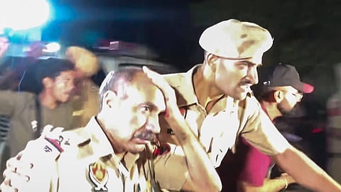Police personnel during a protest by students at the Lovely Professional University (LPU) campus, in Phagwara, Punjab