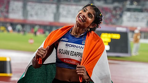 India's Ancy Sojan celebrates after winning silver medal in the women's long jump final event at the ongoing 20th Asian Games, in Nagoya, Japan, Sunday, Sept. 27, 2026.