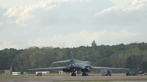 Police guard a road leading to RAF Fairford, a US Airbase, after an incident in Fairford, England