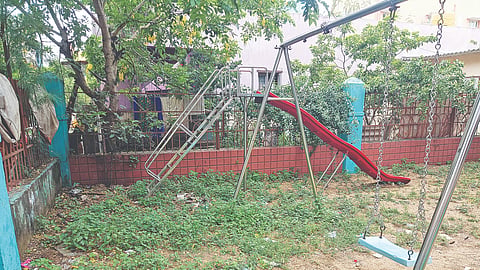 Overgrown weeds and the premises littered with liquor bottles prevent kids from using the park