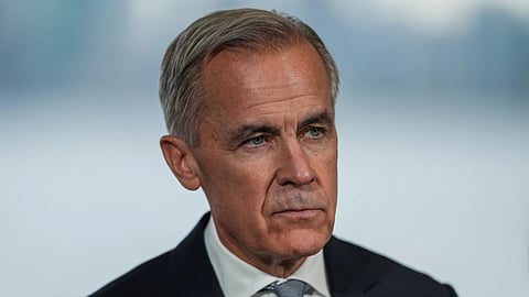 Canadian Prime Minister Mark Carney listens during an announcement about funding for oceans protection, in North Vancouver, British Columbia