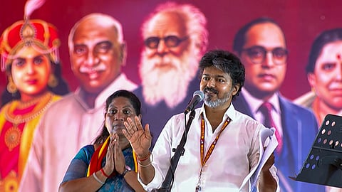 C Joseph Vijay consoles a sobbing candidate Saathyabama during a campaign meeting in Dharapuram on Wednesday 