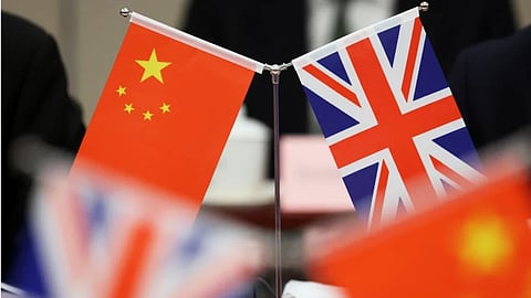 Flags of China and the Union Jack stand during the China-UK Energy Dialogue in Beijing, China.