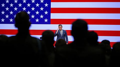 Secretary of Defense Pete Hegseth salutes troops after giving a State of the Force address at Marine Corps Base Quantico.