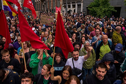 Activists protest near the Spanish Parliament following the eviction of 87-year-old Maricarmen to demand stronger laws to protect renters in Madrid, Spain.