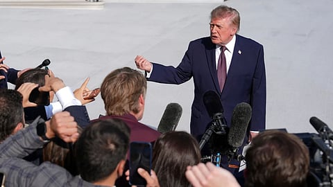 President Donald Trump speaks to reporters on the South Lawn of the White House before boarding Marine One.