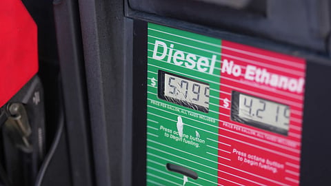 The price of a gallon of diesel fuel is shown electronically on a pump at a QuikTrip station in Greenwood Village, Colo.