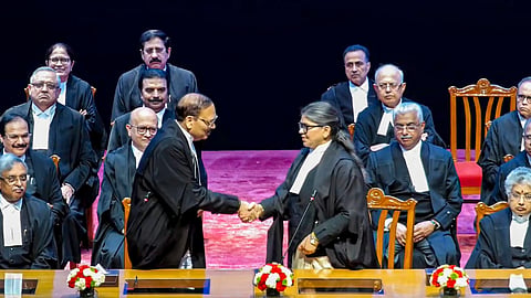 Chief Justice of India (CJI) Surya Kant exchanges greetings with newly appointed Supreme Court judge Sunita Agarwal during a swearing-in ceremony