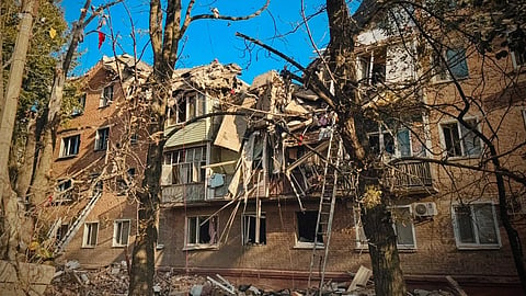 Rescuers work on the scene of a building destroyed following recent Russian attacks in Pryluky, Chernihiv region, Ukraine