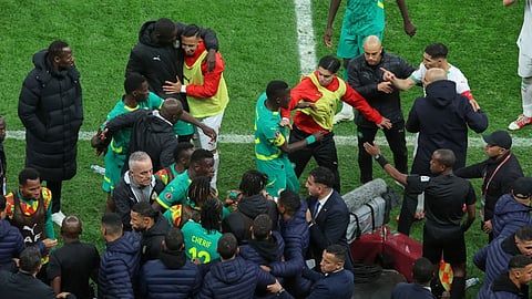 Players from both sides clash after a controversial penalty was awarded to Morocco late on during the Africa Cup of Nations final soccer match between Senegal and Morocco in Rabat, Morocco.