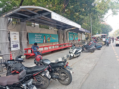 Two-wheelers block access to a bus stop opposite the Collectorate office on Rajaji Road

