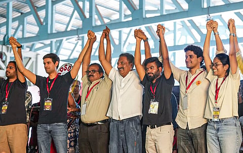 Cockroach Janta Party (CJP) founder Abhijeet Dipke, YouTuber Dhruv Rathee, actor-activist Prakash Raj, and others hold hands during a protest against CEC Gyanesh Kumar over the Special Intensive Revision (SIR) of electoral rolls, in Bengaluru, Thursday, Oct. 8, 2026. 