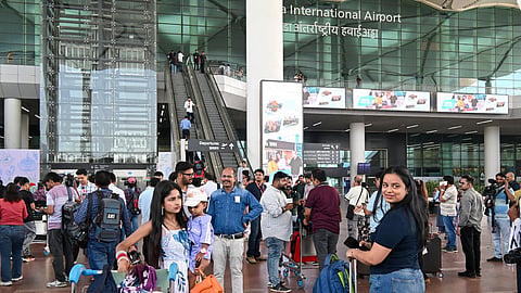 A child dressed as a pilot at the arrivals area of Noida International Airport, in Jewar, Uttar Pradesh, Monday, June 15, 2026. Commercial flight operations at the airport commenced on Monday